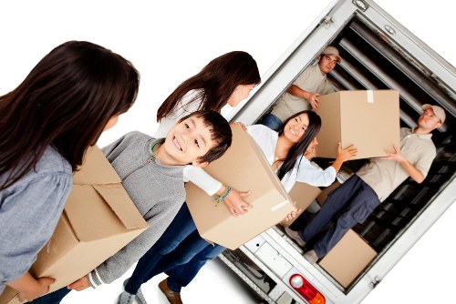 Office relocation planning in Wembley with moving boxes and business furniture