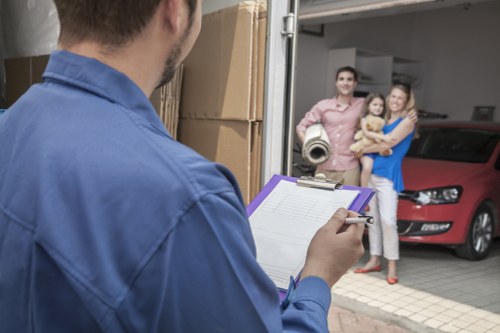 Professional removal team handling fragile household items