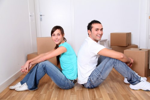 Local moving team handling boxes and appliances