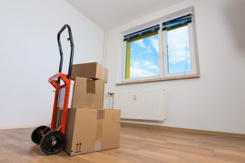 Local moving team handling boxes and furniture in Wembley