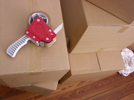 Local moving team handling boxes and furniture in Wembley