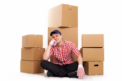 House movers handling furniture access in a Wembley street
