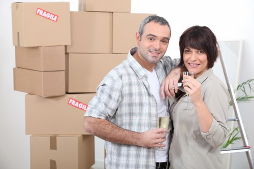 Professional moving team handling boxes in Wembley